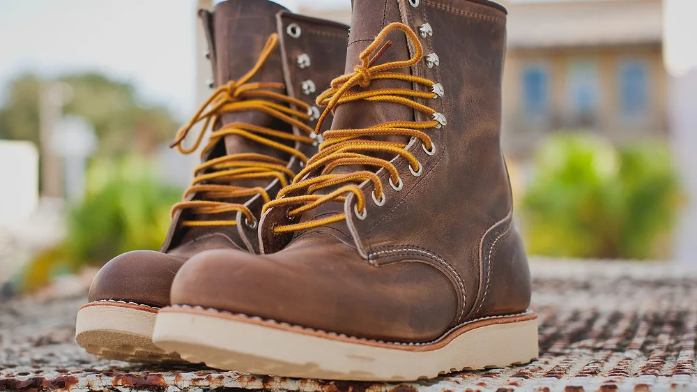 A pair of Red Wing Heritage lace-up boots with yellow laces