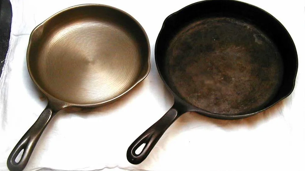 Two cast iron skillets side by side, one polished smooth and one dark and seasoned. Representative photo, not the exact product.
